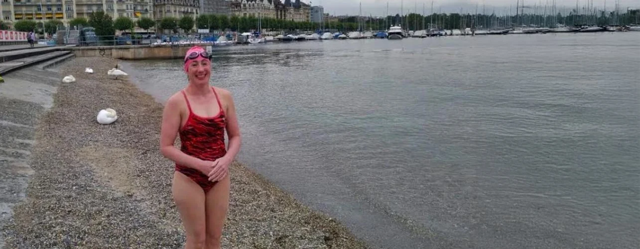 LGSA swimmer beside Lake Geneva